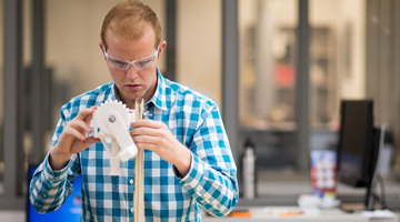 A student working in the Ford shop