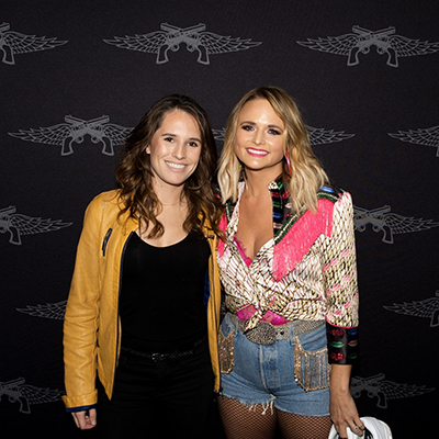 Lewis with country music artist Miranda Lambert and her sneakers.
