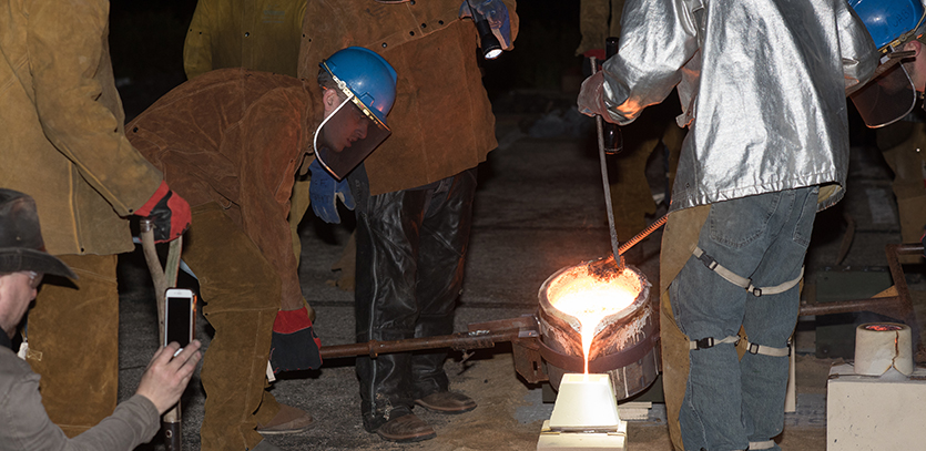 Northwestern students participate in an Iron Pour.