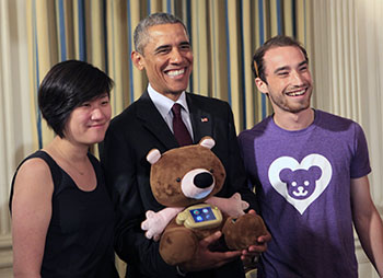 Chung and Horowitz pose with President Obama and Jerry the Bear, their smart stuffed animal that teaches healthy behaviors to children. 