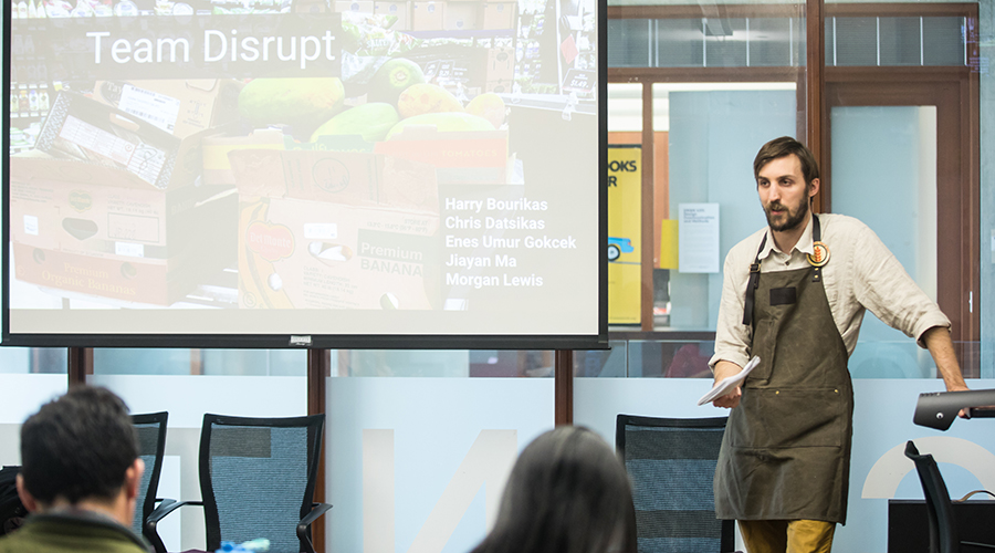 EDI students present solutions to Feeding America representatives.