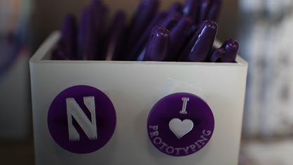 Photo of a Northwestern magnet and purple sharpies