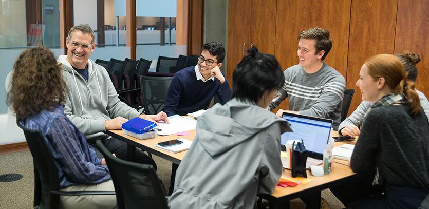 Jim Wicks (left) speaks with EDI students in the Ford Design Studio.