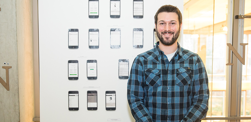 Harrison Bourikas with his thesis project, Shuffle.