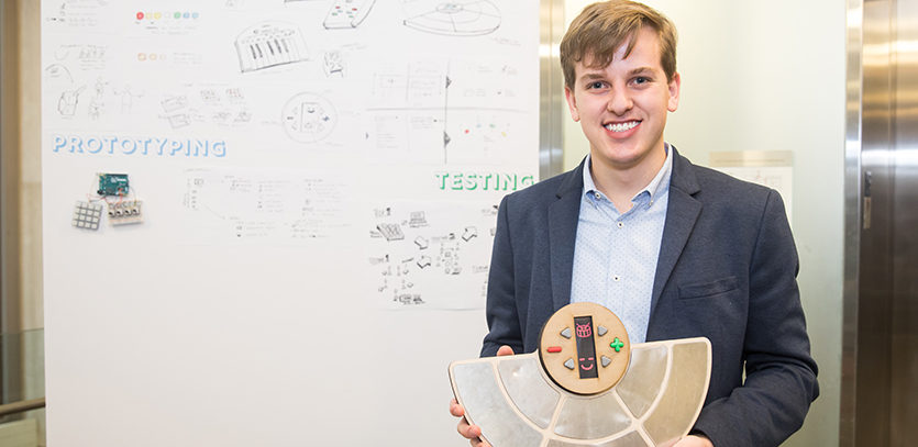Joe Burke with his thesis project, Drumm.