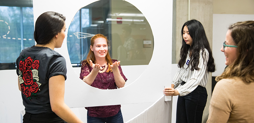 Alyssa Brown (EDI '19) shows a prototype to Barbara Burke of Lurie Children's Hospital.