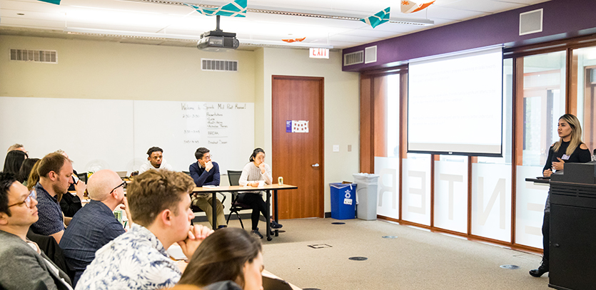 The class listens to Neha Kodi (EDI '19) deliver her mid-point presentation for Actualize Therapy.