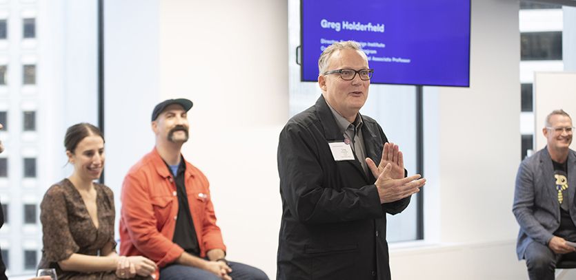 Greg Holderfield introduces the panelists and Jim Wicks.