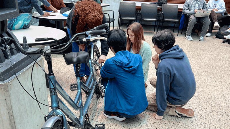 DTC students Amelia Hasting, Elsie Hayduk, David Kovach-Fuentes, and Alvin Xu worked on a prototype to improve the stability of a tandem bike kickstand.