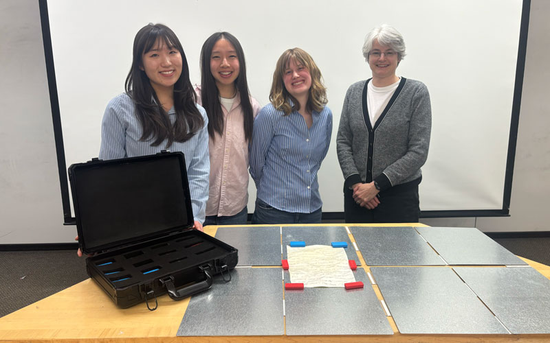 The MagnaFlat student team — Michelle Sheen ('26), Daisy Bai ('26), and Iliana Garner ('26) — presented their final prototype to their project partner, Northwestern law professor Emily Kadens.