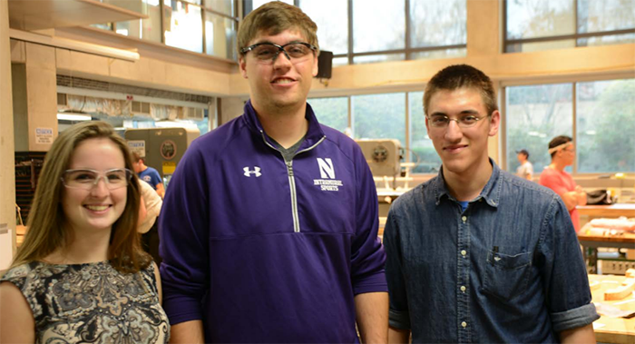 McCormick students Kristin Zubritkzy, Peter Haddad and Tito Fernandez form a student team working on designing a more efficient way to clean quarantine habitats at Shedd Aquarium. 