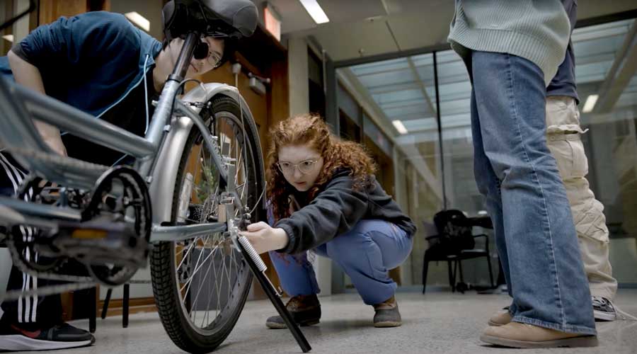 The DTC students drew inspiration from motorcycle kickstands, which are more robust than traditional kickstands.