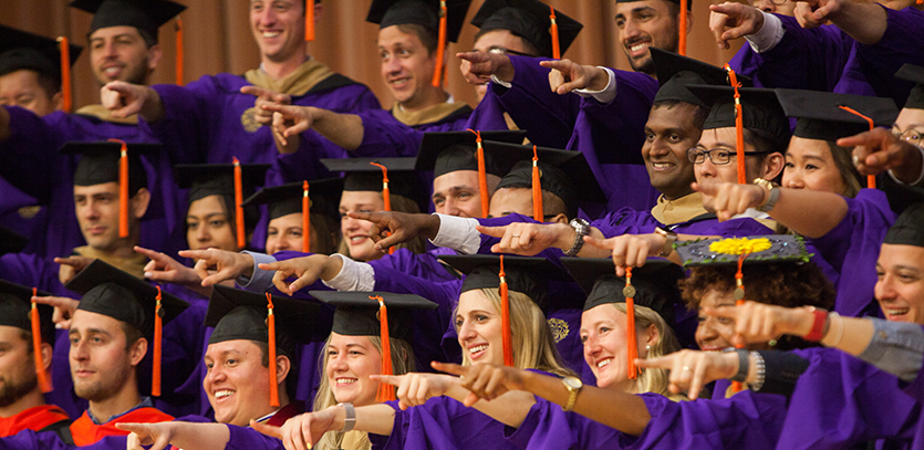 The Class of 2019 graduates from the MMM Program posed for a photo in Ryan Auditorium.