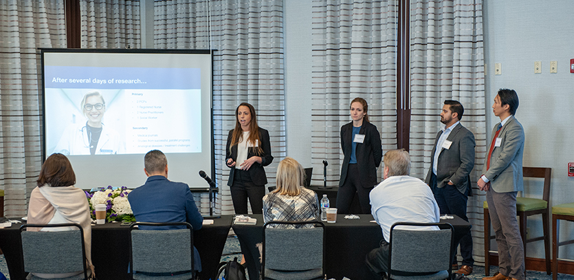 Team HC-Free presents to the judges at AbbVie's offices in Mettawa, Illinois.
